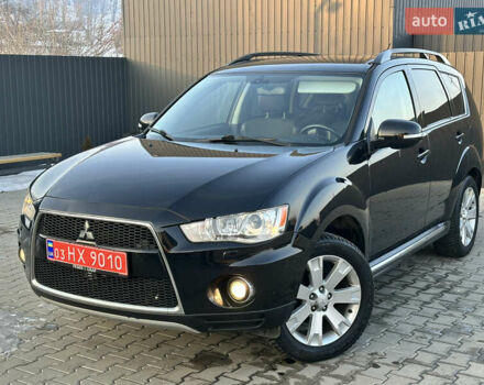Черный Мицубиси Аутлендер, объемом двигателя 2.3 л и пробегом 225 тыс. км за 10750 $, фото 1 на Automoto.ua