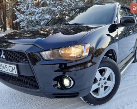Чорний Міцубісі Аутлендер, об'ємом двигуна 2 л та пробігом 115 тис. км за 11800 $, фото 1 на Automoto.ua
