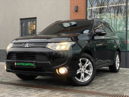 Черный Мицубиси Аутлендер, объемом двигателя 2.4 л и пробегом 212 тыс. км за 12990 $, фото 1 на Automoto.ua