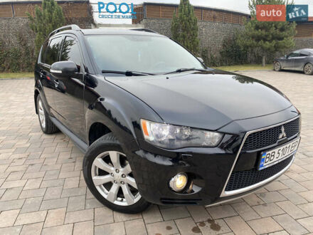 Черный Мицубиси Аутлендер, объемом двигателя 2.4 л и пробегом 242 тыс. км за 10000 $, фото 1 на Automoto.ua