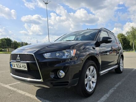Черный Мицубиси Аутлендер, объемом двигателя 2.4 л и пробегом 261 тыс. км за 10700 $, фото 1 на Automoto.ua
