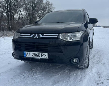 Черный Мицубиси Аутлендер, объемом двигателя 2.4 л и пробегом 249 тыс. км за 12800 $, фото 1 на Automoto.ua