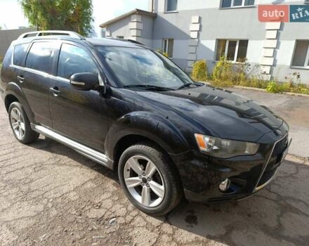 Черный Мицубиси Аутлендер, объемом двигателя 2.2 л и пробегом 218 тыс. км за 11800 $, фото 1 на Automoto.ua