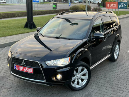 Черный Мицубиси Аутлендер, объемом двигателя 2.3 л и пробегом 124 тыс. км за 11999 $, фото 1 на Automoto.ua