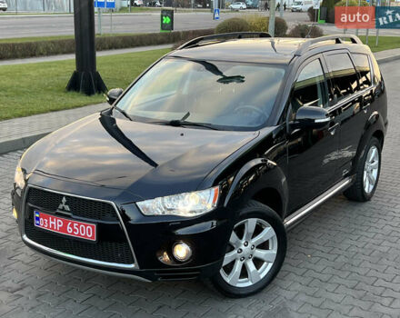 Черный Мицубиси Аутлендер, объемом двигателя 2.3 л и пробегом 124 тыс. км за 11999 $, фото 1 на Automoto.ua