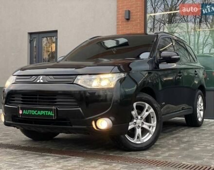 Черный Мицубиси Аутлендер, объемом двигателя 2.36 л и пробегом 212 тыс. км за 12990 $, фото 1 на Automoto.ua