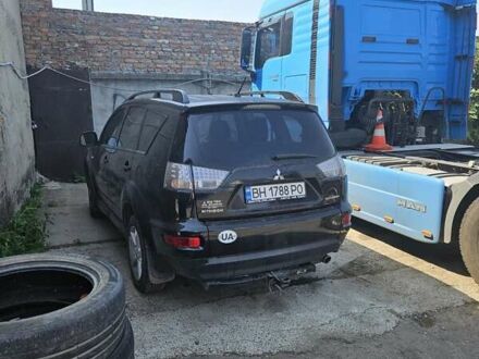 Черный Мицубиси Аутлендер, объемом двигателя 2.36 л и пробегом 164 тыс. км за 10800 $, фото 1 на Automoto.ua