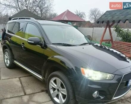 Черный Мицубиси Аутлендер, объемом двигателя 2.2 л и пробегом 218 тыс. км за 11500 $, фото 1 на Automoto.ua