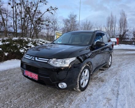 Черный Мицубиси Аутлендер, объемом двигателя 2 л и пробегом 158 тыс. км за 13850 $, фото 1 на Automoto.ua
