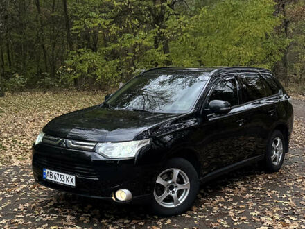 Черный Мицубиси Аутлендер, объемом двигателя 2.36 л и пробегом 168 тыс. км за 11700 $, фото 1 на Automoto.ua