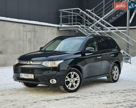 Черный Мицубиси Аутлендер, объемом двигателя 2.36 л и пробегом 198 тыс. км за 13000 $, фото 1 на Automoto.ua