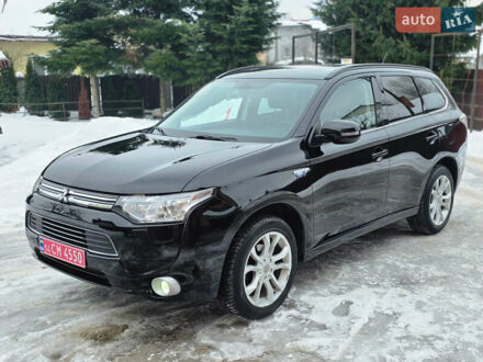 Черный Мицубиси Аутлендер, объемом двигателя 2 л и пробегом 185 тыс. км за 13599 $, фото 1 на Automoto.ua