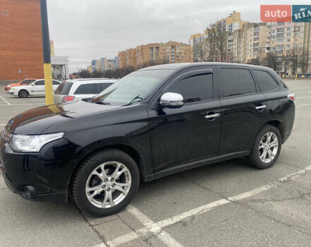 Черный Мицубиси Аутлендер, объемом двигателя 2.4 л и пробегом 150 тыс. км за 13700 $, фото 1 на Automoto.ua