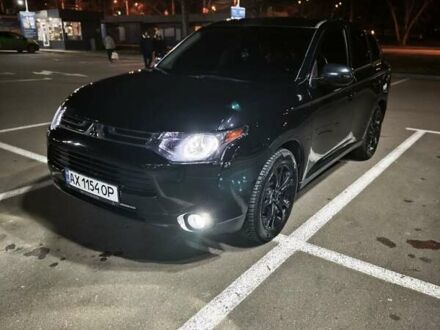 Черный Мицубиси Аутлендер, объемом двигателя 2.36 л и пробегом 226 тыс. км за 12499 $, фото 1 на Automoto.ua