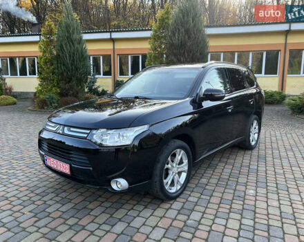 Черный Мицубиси Аутлендер, объемом двигателя 2 л и пробегом 190 тыс. км за 12500 $, фото 1 на Automoto.ua