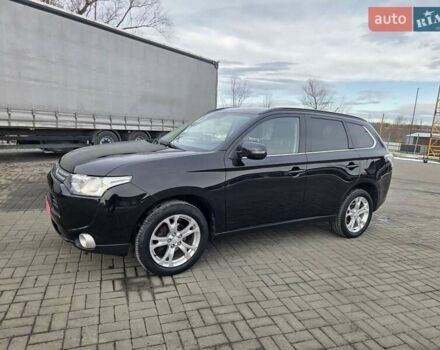 Черный Мицубиси Аутлендер, объемом двигателя 2.3 л и пробегом 233 тыс. км за 11600 $, фото 1 на Automoto.ua