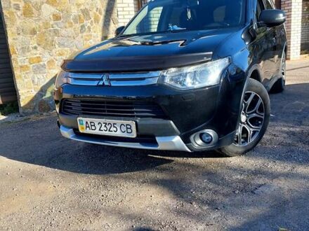 Черный Мицубиси Аутлендер, объемом двигателя 2.4 л и пробегом 183 тыс. км за 15000 $, фото 1 на Automoto.ua