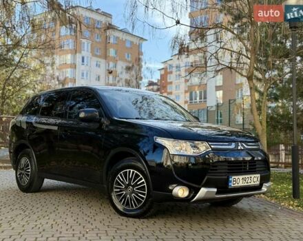 Черный Мицубиси Аутлендер, объемом двигателя 2.4 л и пробегом 270 тыс. км за 12500 $, фото 1 на Automoto.ua
