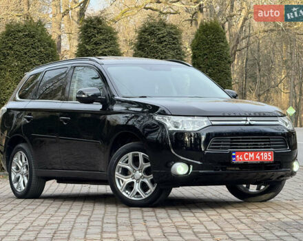 Черный Мицубиси Аутлендер, объемом двигателя 2 л и пробегом 173 тыс. км за 15299 $, фото 1 на Automoto.ua