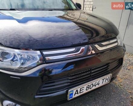 Черный Мицубиси Аутлендер, объемом двигателя 2.4 л и пробегом 220 тыс. км за 13400 $, фото 1 на Automoto.ua