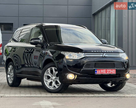 Черный Мицубиси Аутлендер, объемом двигателя 2 л и пробегом 157 тыс. км за 15299 $, фото 1 на Automoto.ua