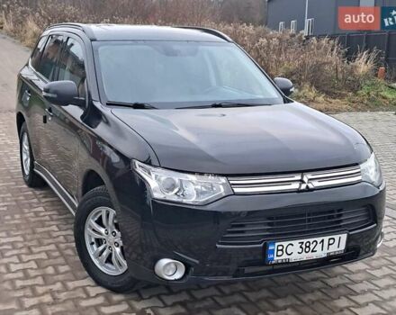 Черный Мицубиси Аутлендер, объемом двигателя 2 л и пробегом 170 тыс. км за 12990 $, фото 1 на Automoto.ua