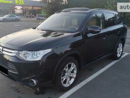 Черный Мицубиси Аутлендер, объемом двигателя 2.4 л и пробегом 170 тыс. км за 12500 $, фото 1 на Automoto.ua