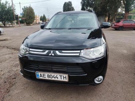 Черный Мицубиси Аутлендер, объемом двигателя 2.4 л и пробегом 220 тыс. км за 13400 $, фото 1 на Automoto.ua