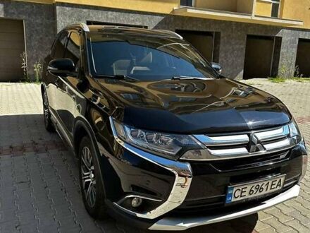 Черный Мицубиси Аутлендер, объемом двигателя 2.36 л и пробегом 225 тыс. км за 13699 $, фото 1 на Automoto.ua