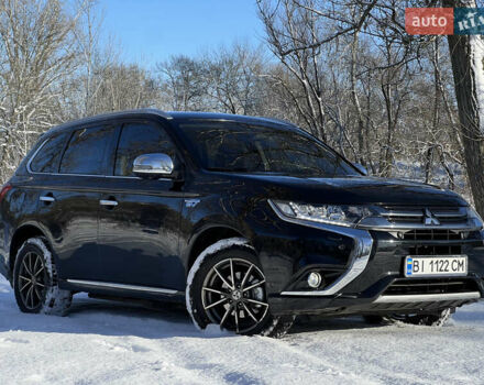 Черный Мицубиси Аутлендер, объемом двигателя 2 л и пробегом 239 тыс. км за 18200 $, фото 1 на Automoto.ua