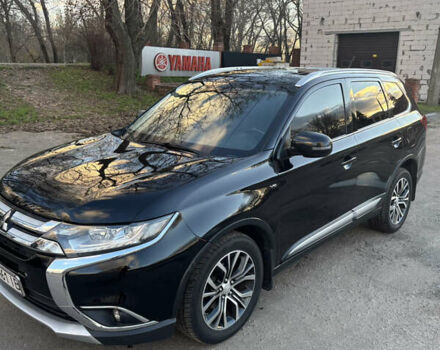 Черный Мицубиси Аутлендер, объемом двигателя 3 л и пробегом 122 тыс. км за 17645 $, фото 1 на Automoto.ua