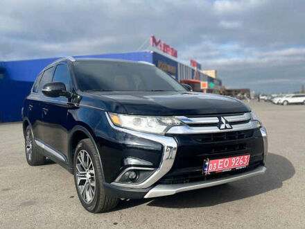 Черный Мицубиси Аутлендер, объемом двигателя 2.36 л и пробегом 91 тыс. км за 15500 $, фото 1 на Automoto.ua