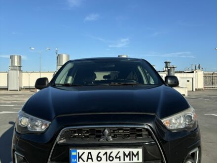 Черный Мицубиси Аутлендер, объемом двигателя 2 л и пробегом 105 тыс. км за 9999 $, фото 1 на Automoto.ua