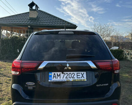 Черный Мицубиси Аутлендер, объемом двигателя 2.36 л и пробегом 144 тыс. км за 15300 $, фото 1 на Automoto.ua