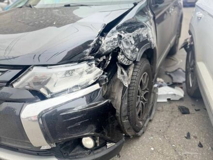 Черный Мицубиси Аутлендер, объемом двигателя 2.4 л и пробегом 170 тыс. км за 9000 $, фото 1 на Automoto.ua