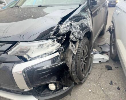 Черный Мицубиси Аутлендер, объемом двигателя 2.4 л и пробегом 170 тыс. км за 9000 $, фото 1 на Automoto.ua