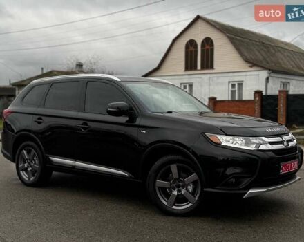 Черный Мицубиси Аутлендер, объемом двигателя 3 л и пробегом 99 тыс. км за 15980 $, фото 1 на Automoto.ua