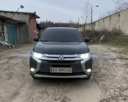 Черный Мицубиси Аутлендер, объемом двигателя 2.4 л и пробегом 185 тыс. км за 14300 $, фото 1 на Automoto.ua