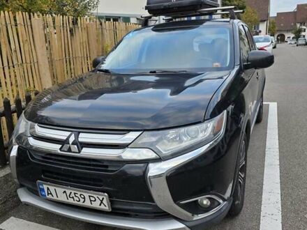 Черный Мицубиси Аутлендер, объемом двигателя 2.4 л и пробегом 195 тыс. км за 13953 $, фото 1 на Automoto.ua