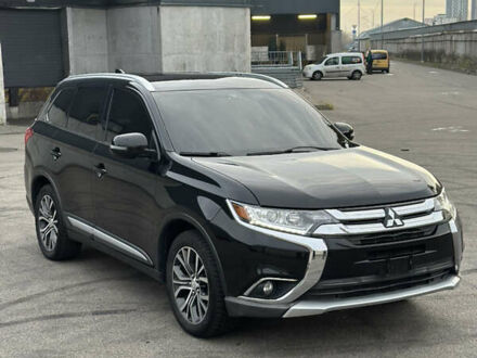 Черный Мицубиси Аутлендер, объемом двигателя 2.36 л и пробегом 128 тыс. км за 15500 $, фото 1 на Automoto.ua