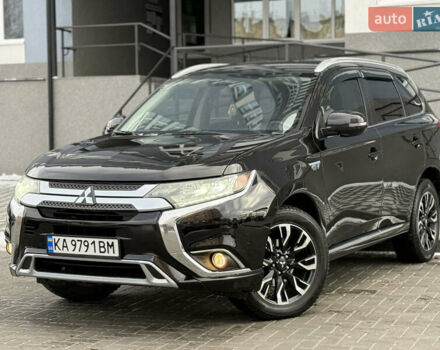 Черный Мицубиси Аутлендер, объемом двигателя 2 л и пробегом 107 тыс. км за 18500 $, фото 1 на Automoto.ua