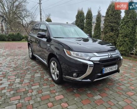 Черный Мицубиси Аутлендер, объемом двигателя 2 л и пробегом 98 тыс. км за 18350 $, фото 1 на Automoto.ua