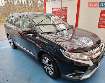 Черный Мицубиси Аутлендер, объемом двигателя 2 л и пробегом 114 тыс. км за 17600 $, фото 1 на Automoto.ua