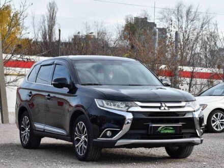 Черный Мицубиси Аутлендер, объемом двигателя 2.4 л и пробегом 154 тыс. км за 13499 $, фото 1 на Automoto.ua