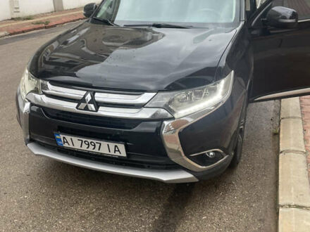 Черный Мицубиси Аутлендер, объемом двигателя 2.4 л и пробегом 180 тыс. км за 15500 $, фото 1 на Automoto.ua