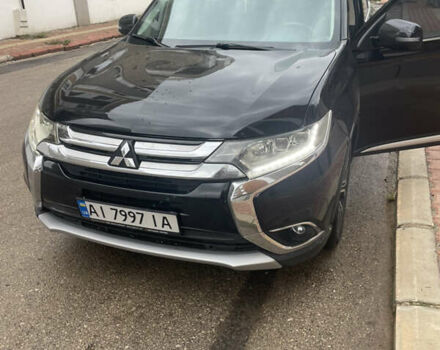 Чорний Міцубісі Аутлендер, об'ємом двигуна 2.4 л та пробігом 180 тис. км за 15500 $, фото 1 на Automoto.ua