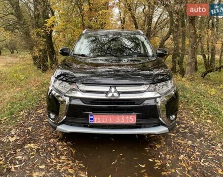 Чорний Міцубісі Аутлендер, об'ємом двигуна 2 л та пробігом 75 тис. км за 22100 $, фото 1 на Automoto.ua