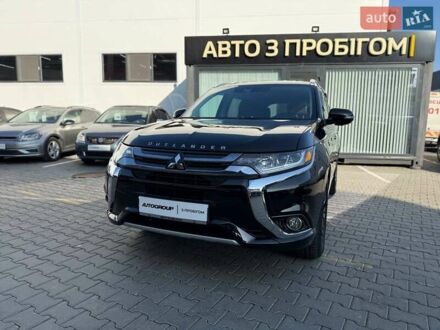 Черный Мицубиси Аутлендер, объемом двигателя 2 л и пробегом 67 тыс. км за 23000 $, фото 1 на Automoto.ua