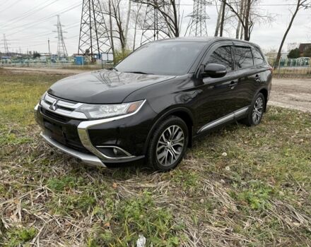 Черный Мицубиси Аутлендер, объемом двигателя 2.4 л и пробегом 130 тыс. км за 14950 $, фото 1 на Automoto.ua