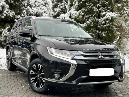 Черный Мицубиси Аутлендер, объемом двигателя 2 л и пробегом 65 тыс. км за 13200 $, фото 1 на Automoto.ua